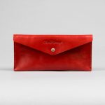 red leather coupon holder