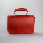 red leather top handle purse